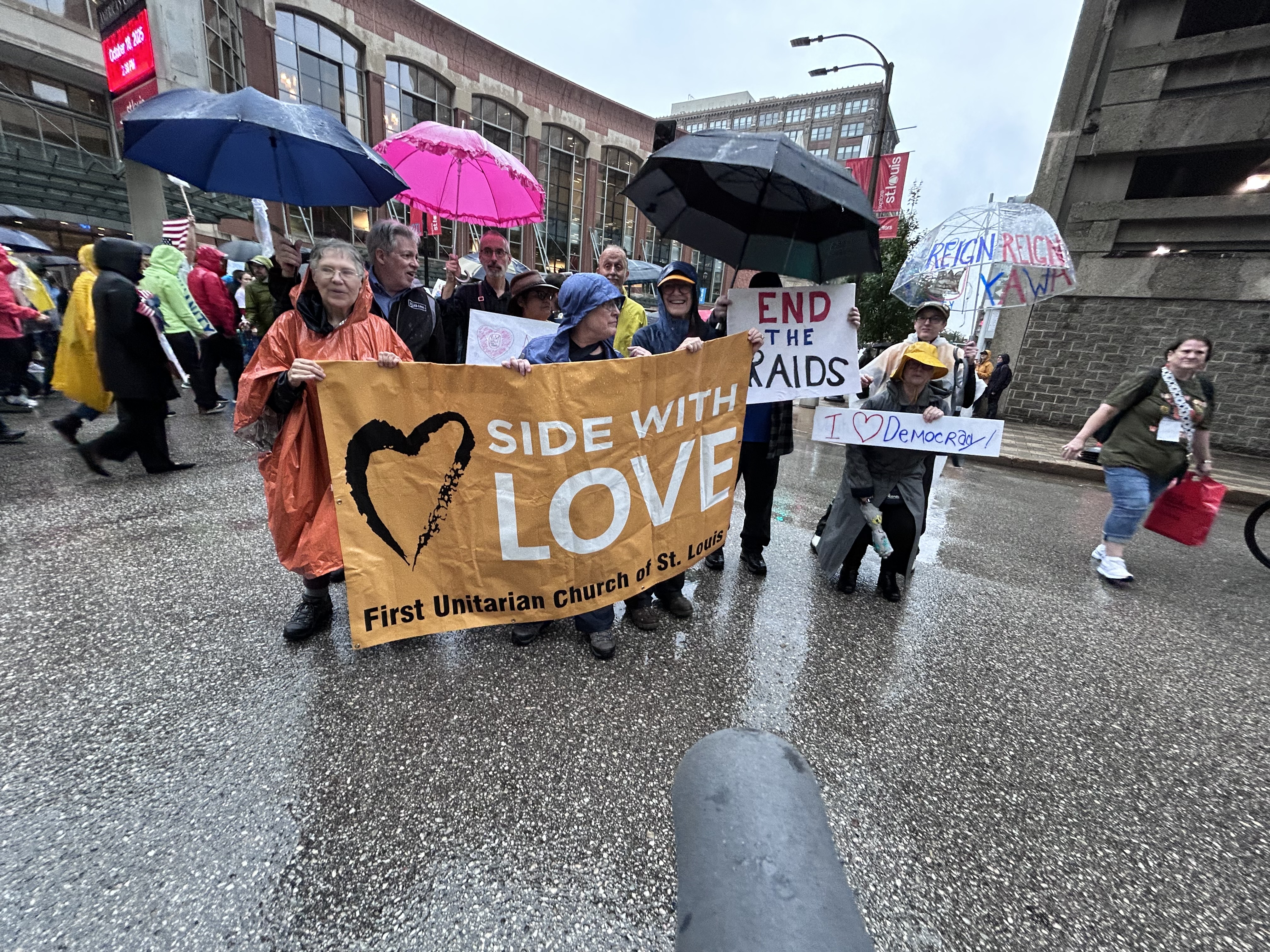 people behind a "side with love" banner